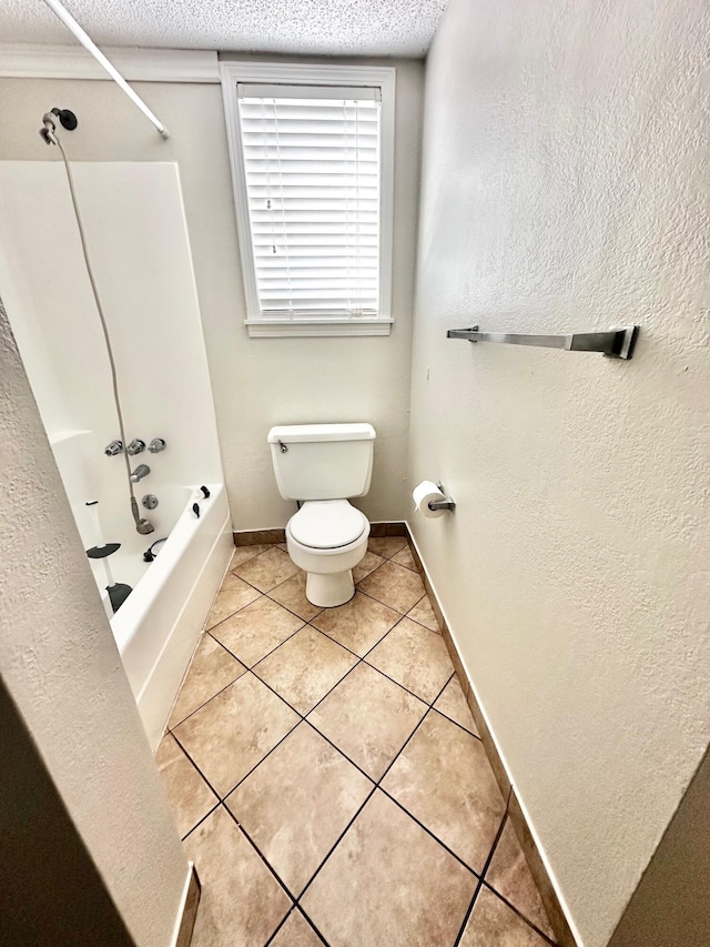 full bathroom with shower / bath combination, baseboards, toilet, tile patterned flooring, and a textured ceiling