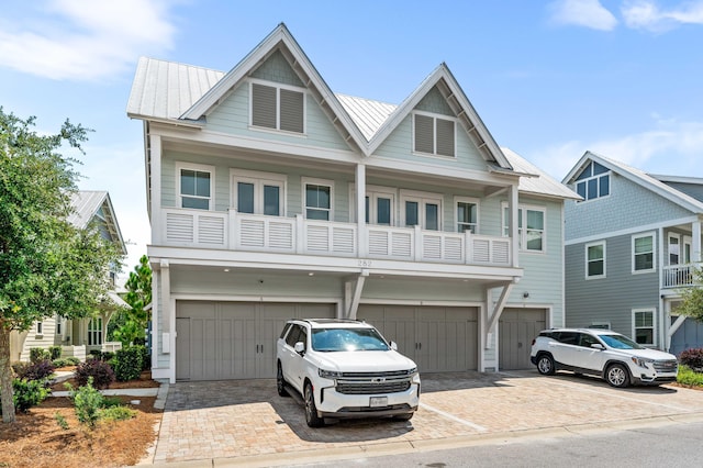 craftsman-style house with a garage and a balcony