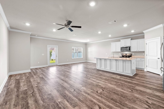 kitchen featuring white cabinets, a center island with sink, ceiling fan, ornamental molding, and stainless steel appliances