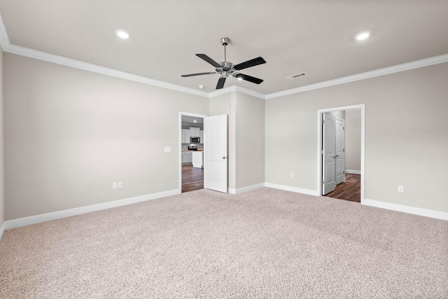 unfurnished bedroom featuring dark colored carpet, ceiling fan, and ornamental molding