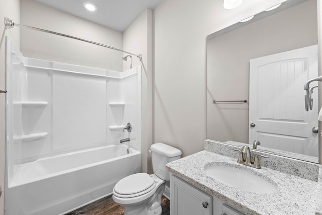 full bathroom featuring shower / bathing tub combination, vanity, toilet, and wood-type flooring