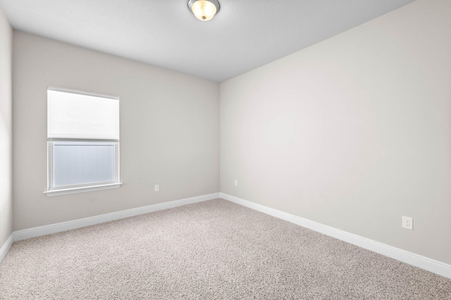 unfurnished room with carpet flooring