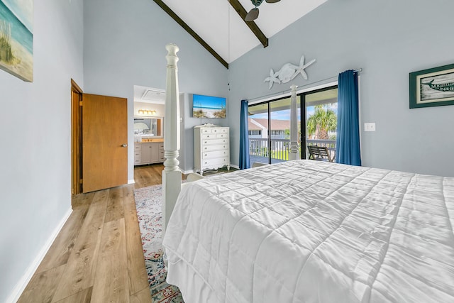 bedroom with access to exterior, ensuite bath, ceiling fan, light hardwood / wood-style flooring, and high vaulted ceiling