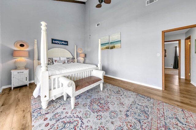 bedroom with hardwood / wood-style flooring