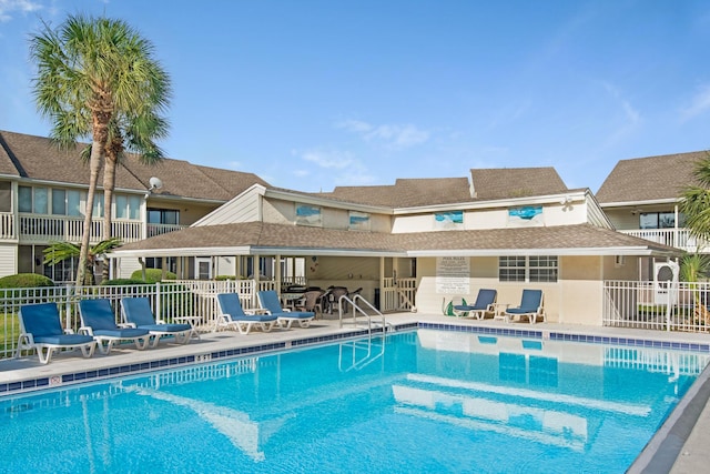 view of swimming pool with a patio