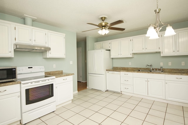 kitchen featuring hanging light fixtures, sink, white appliances, white cabinetry, and ceiling fan with notable chandelier