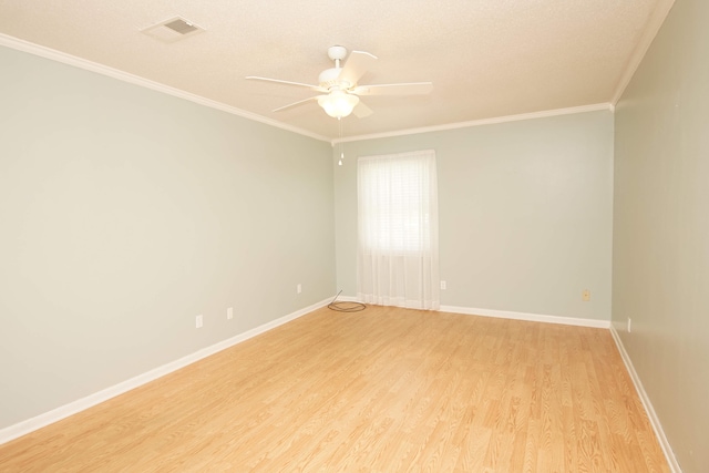 spare room with light hardwood / wood-style flooring, ceiling fan, ornamental molding, and a textured ceiling