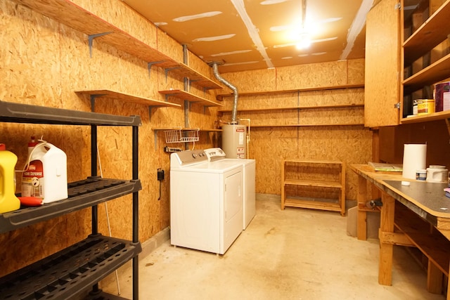 washroom with gas water heater, independent washer and dryer, and laundry area