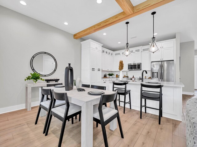 140 Sibert Ave Unit 16, Destin, FL 32541 - dining room with beam ceiling, light wood finished floors, recessed lighting, and baseboards