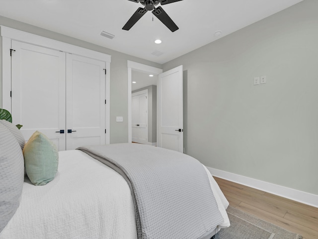 140 Sibert Ave Unit 16, Destin, FL 32541 - bedroom with wood finished floors, recessed lighting, baseboards, a closet, and ceiling fan