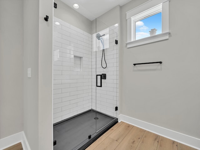 140 Sibert Ave Unit 16, Destin, FL 32541 - bathroom featuring a shower stall, baseboards, wood finished floors, and recessed lighting