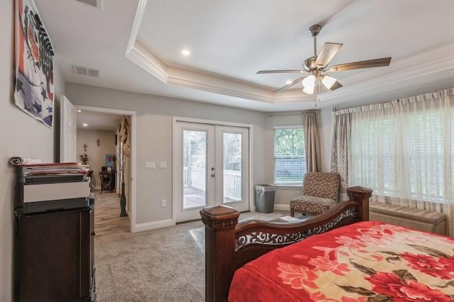 carpeted bedroom with french doors, access to outside, ceiling fan, a raised ceiling, and ornamental molding