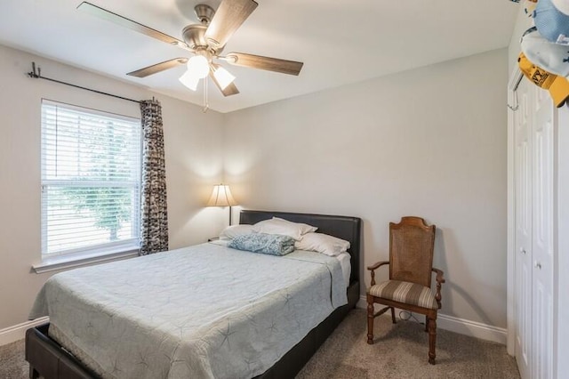 carpeted bedroom with a closet and ceiling fan