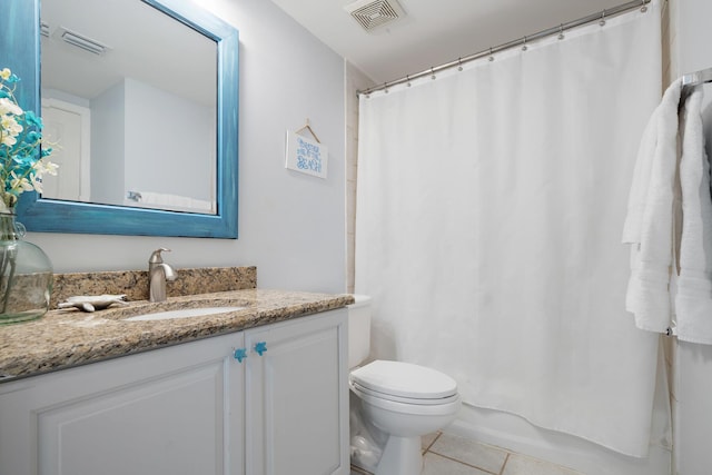 full bathroom featuring tile patterned flooring, vanity, toilet, and shower / bath combo