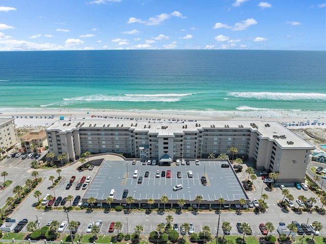 bird's eye view featuring a water view and a view of the beach