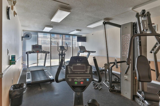 gym with a textured ceiling