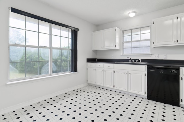 kitchen with dishwasher, sink, white cabinets, and a textured ceiling