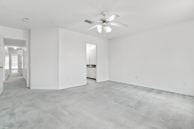 carpeted empty room with ceiling fan