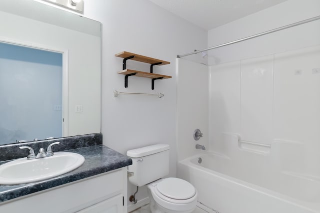 bathroom featuring toilet, shower / bathtub combination, and vanity