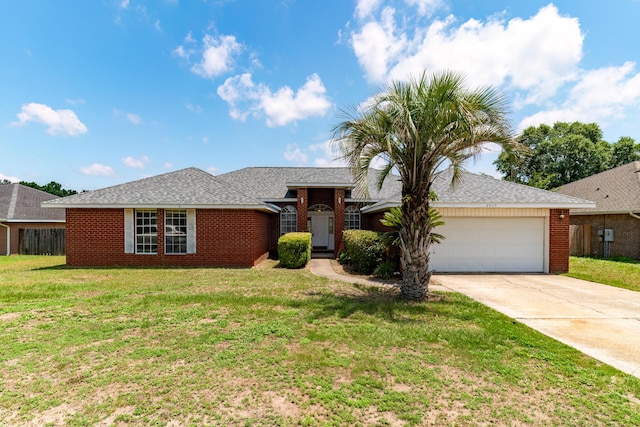 ranch-style house with a garage, driveway, brick siding, and a front yard