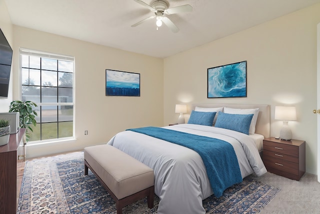 carpeted bedroom featuring a ceiling fan