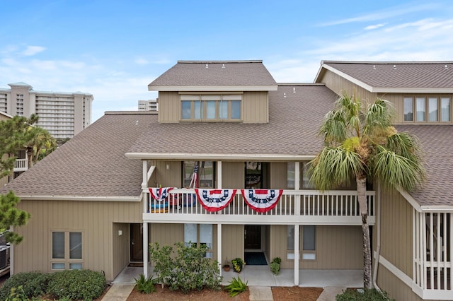 rear view of property featuring a patio area