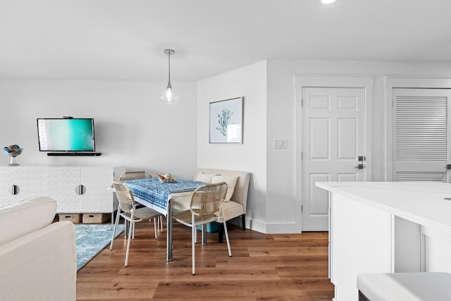 dining area with wood-type flooring