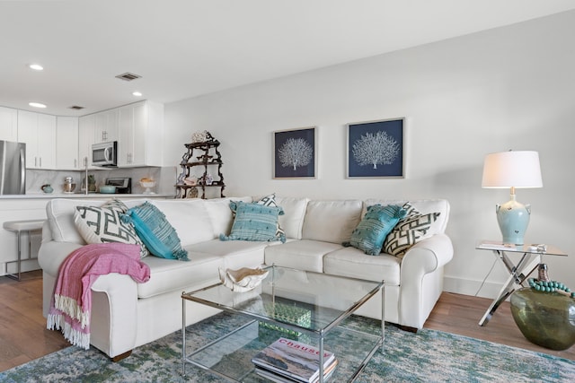 living room featuring dark wood-type flooring