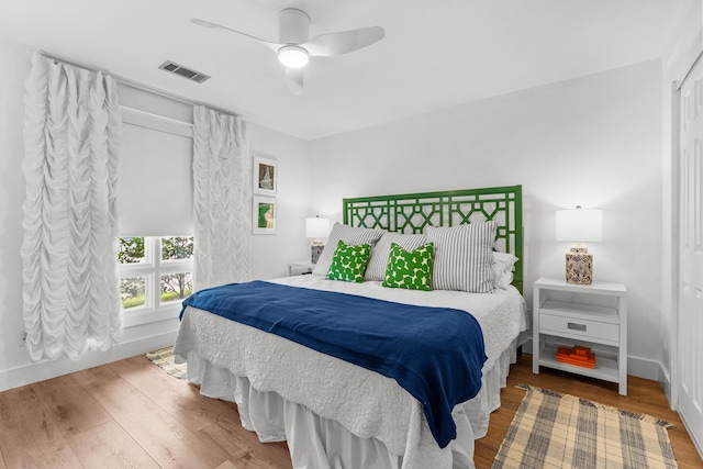 bedroom featuring hardwood / wood-style floors and ceiling fan