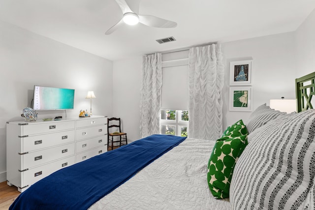 bedroom with ceiling fan and light hardwood / wood-style flooring