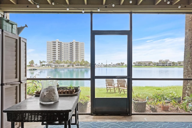 sunroom with a water view