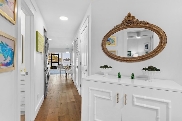 corridor with hardwood / wood-style floors