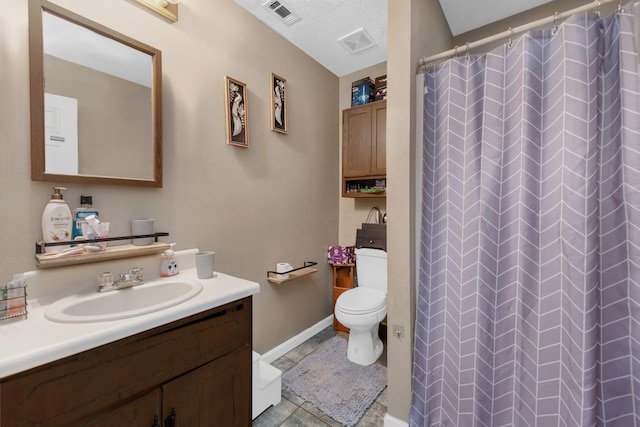 bathroom with toilet, curtained shower, tile patterned floors, vanity, and a textured ceiling