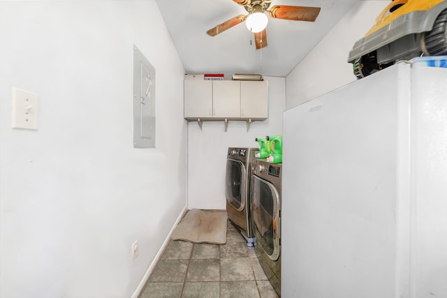 laundry area with electric panel, washer and dryer, ceiling fan, and cabinets