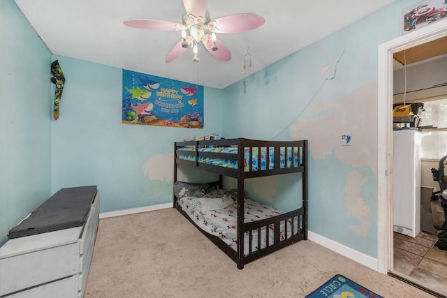 bedroom with ceiling fan and light colored carpet