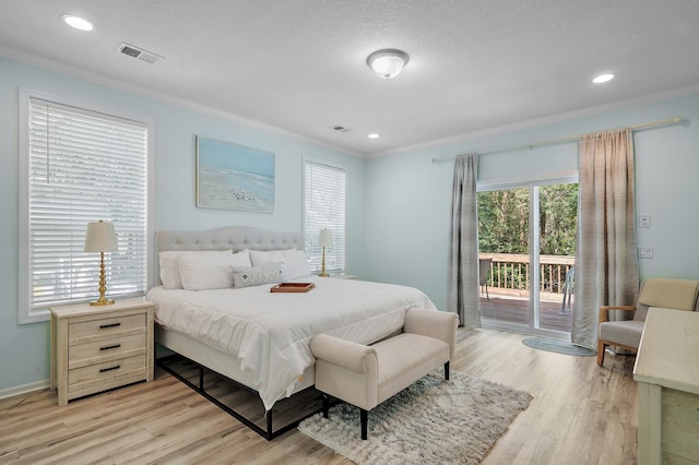 bedroom with light wood-type flooring, a textured ceiling, access to outside, and ornamental molding