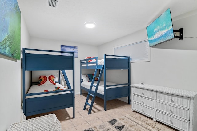 bedroom featuring light tile patterned floors and visible vents