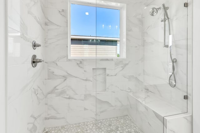 bathroom featuring an enclosed shower