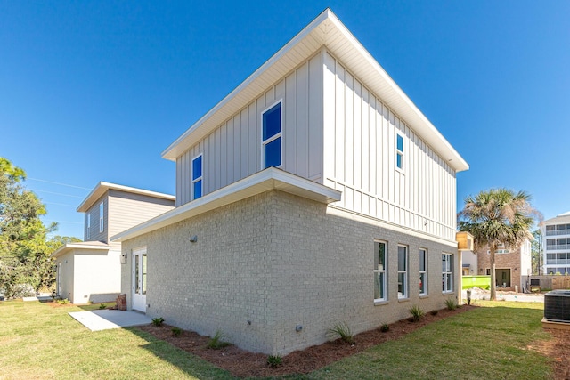 view of property exterior featuring a lawn and central AC unit