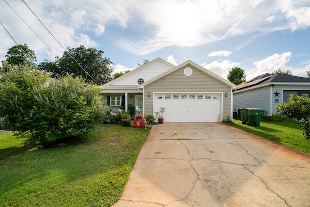 view of front of house featuring a garage and a front lawn