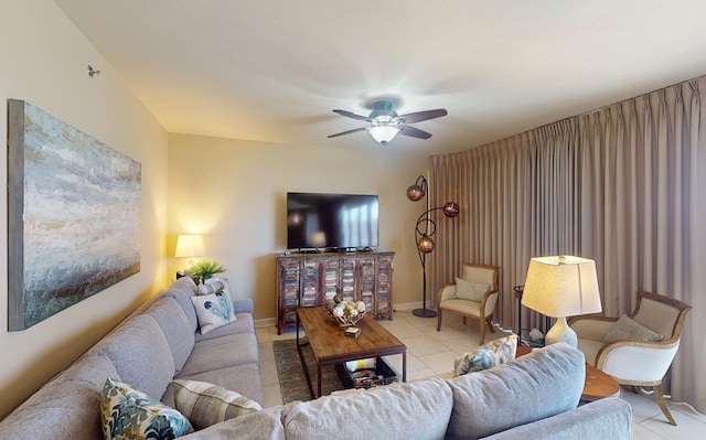 living room featuring ceiling fan and light tile patterned floors