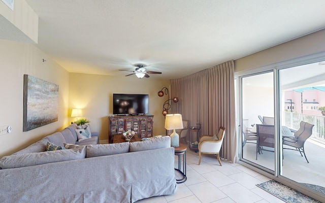 living room featuring ceiling fan and light tile patterned flooring