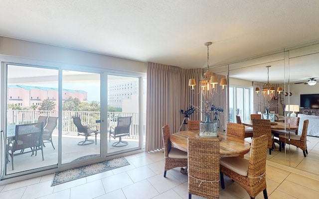 tiled dining space featuring a chandelier