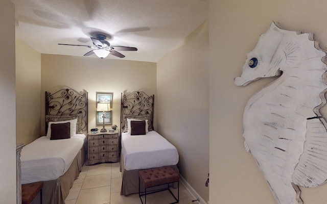 tiled bedroom with ceiling fan