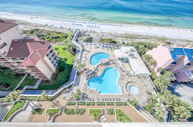 drone / aerial view with a view of the beach and a water view