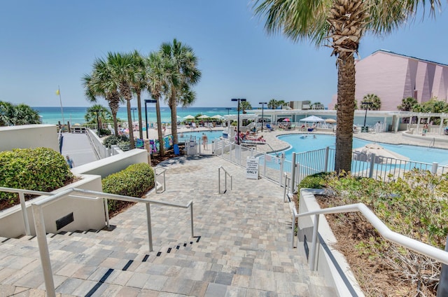 exterior space with a water view and a patio