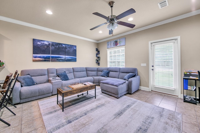 living room with ornamental molding, ceiling fan, and light tile patterned flooring