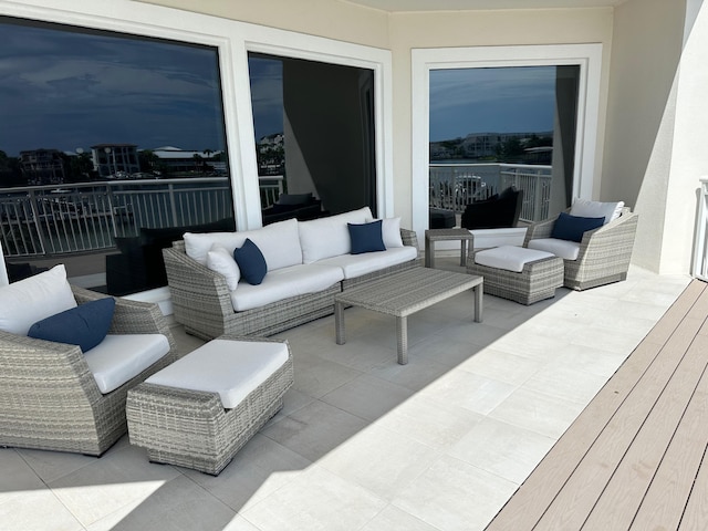 view of patio featuring a balcony and outdoor lounge area