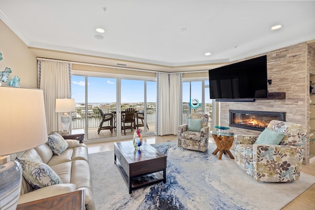 living room featuring tile patterned floors, crown molding, and a fireplace