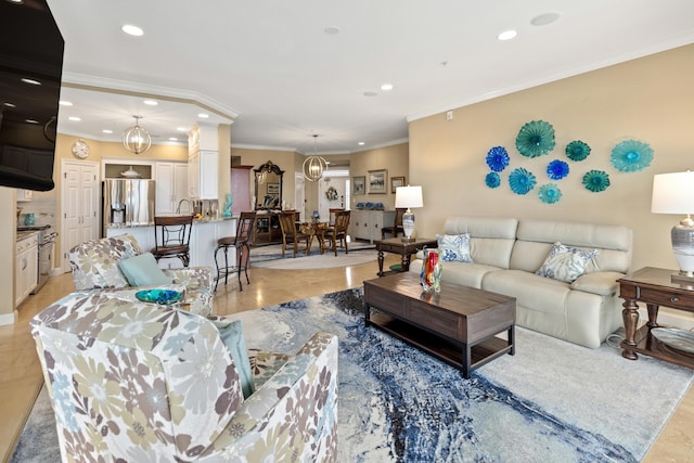 living room featuring crown molding and a notable chandelier